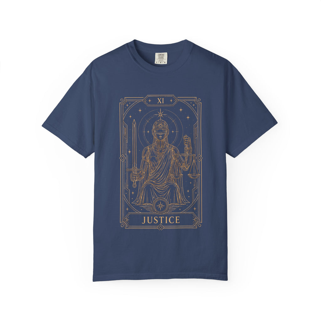 Blue Comfort Colors t-shirt featuring Justice from the Future Arcana collection, inspired by the Justice tarot card. A futuristic blindfolded guardian holds a sword and balanced scales within an elegant Art Deco celestial frame rendered in vintage gold line art on a transparent background.