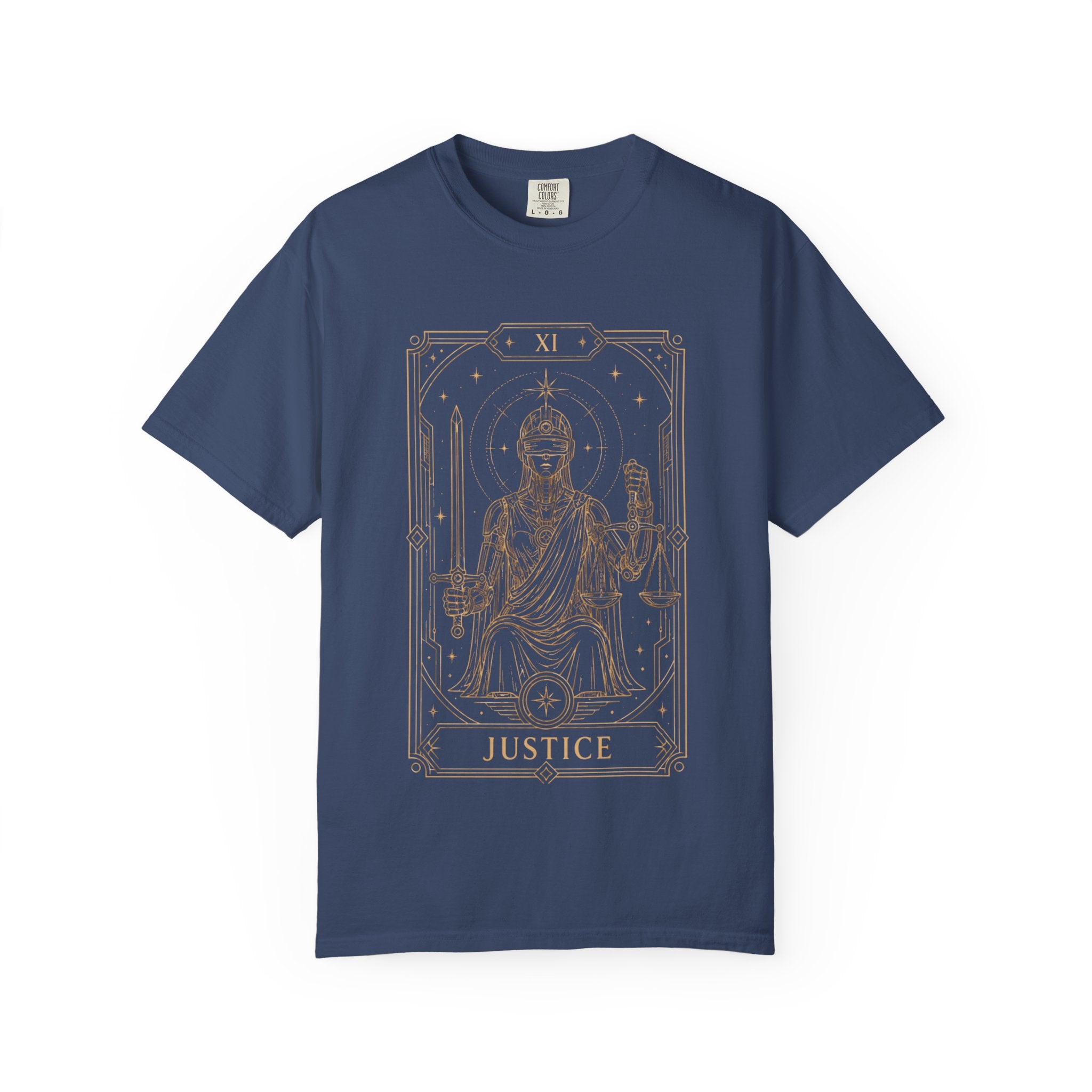 Blue Comfort Colors t-shirt featuring Justice from the Future Arcana collection, inspired by the Justice tarot card. A futuristic blindfolded guardian holds a sword and balanced scales within an elegant Art Deco celestial frame rendered in vintage gold line art on a transparent background.