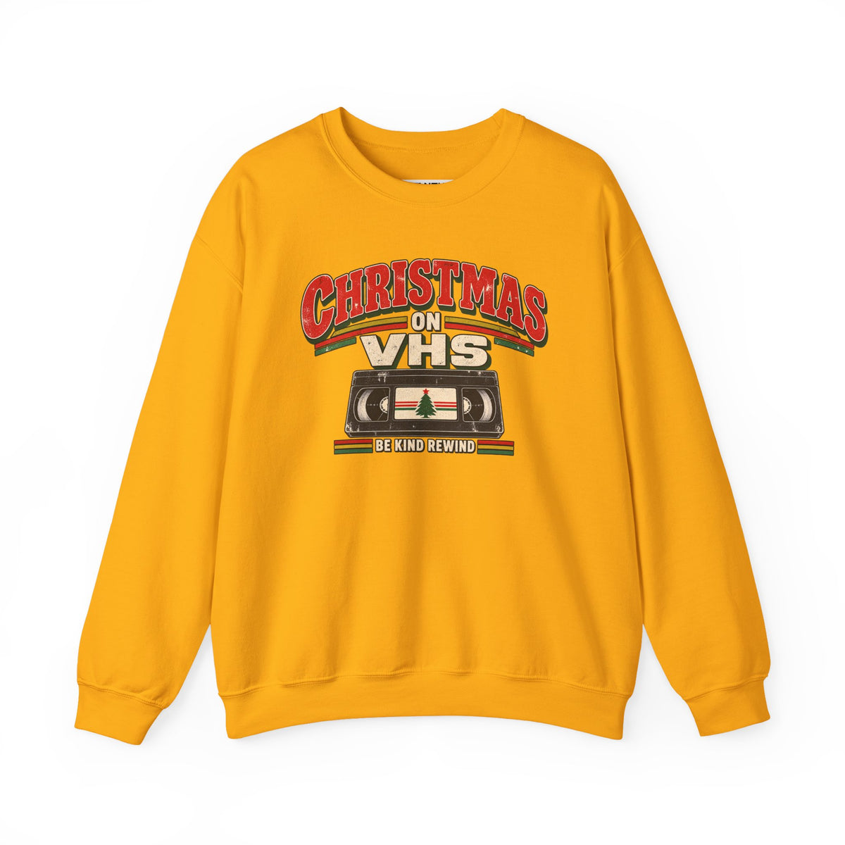 A yellow crewneck sweatshirt featuring a retro VHS graphic on the chest that reads 'CHRISTMAS ON VHS' with 'BE KIND REWIND' underneath, displayed on a clean white background.