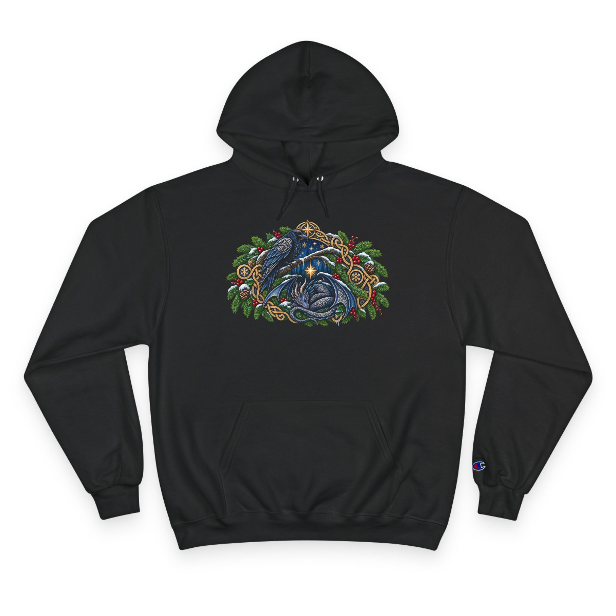 A black pullover hoodie featuring a detailed graphic of a blue raven and a dragon surrounded by green pine boughs  A small blue Champion 'C' logo is visible on the left sleeve cuff. against a white background
