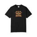 An black short-sleeve crewneck t-shirt featuring a graphic print on the chest that reads 'TOO OLD FOR DRAMA BUT OLD ENOUGH FOR DRAGONS' in a stylized gold and black dragon-themed font.