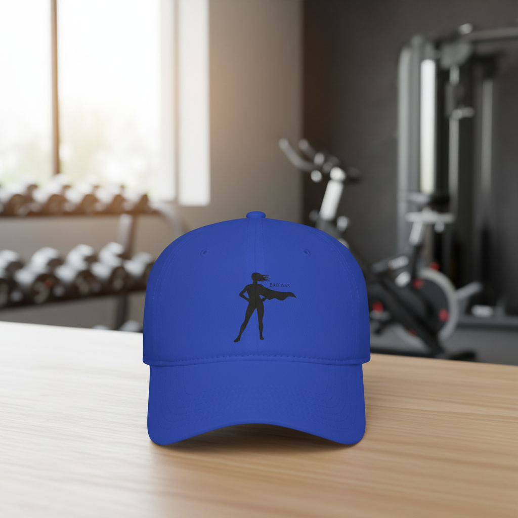 Bad Ass superhero silhouette retro heroine baseball cap in royal blue, shown on a table in a gym setting
