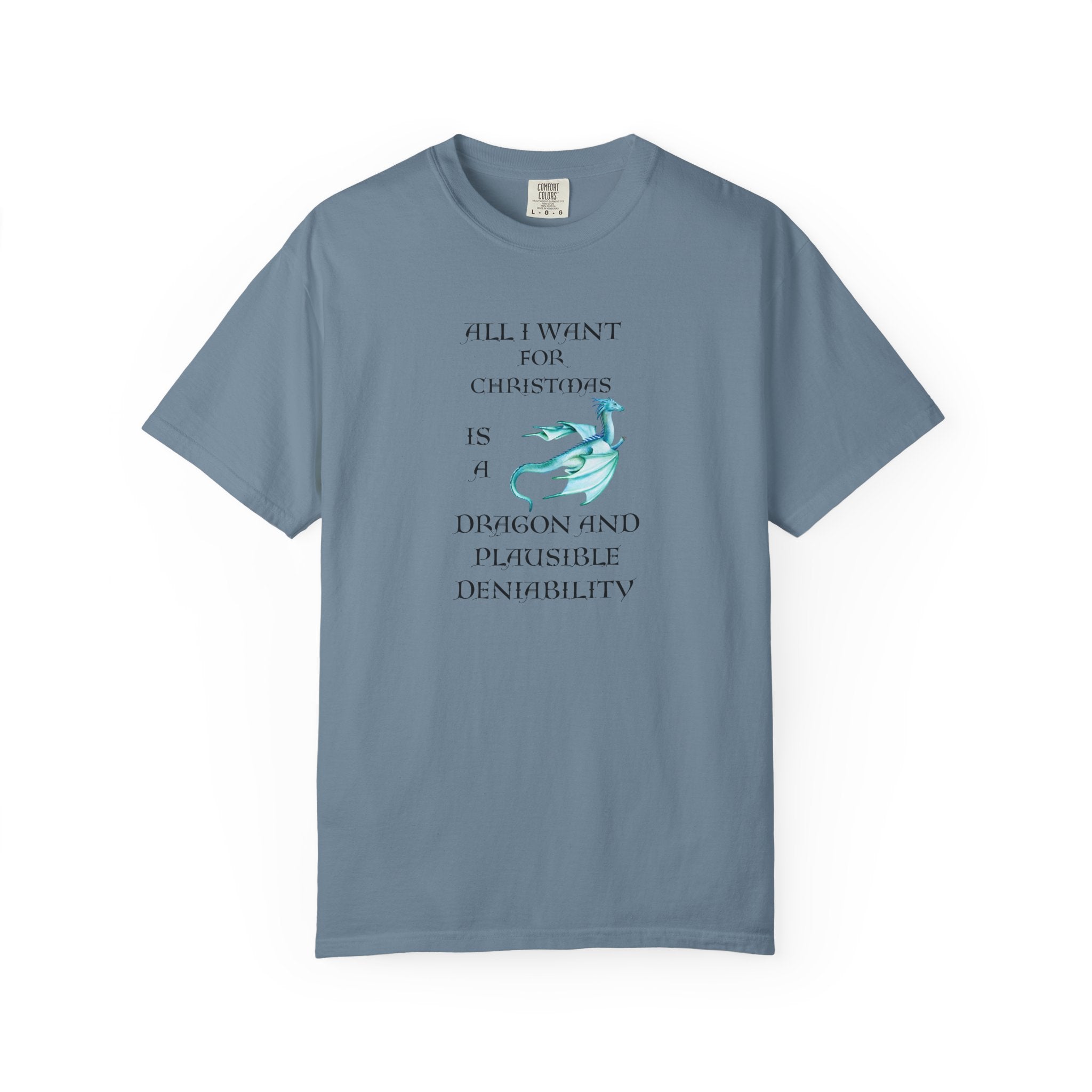  A blue short-sleeve t-shirt with a graphic print on the front. The print features dark green text that reads 'ALL I WANT FOR CHRISTMAS IS A DRAGON AND PLAUSIBLE DENIABILITY' alongside a light blue dragon illustration.