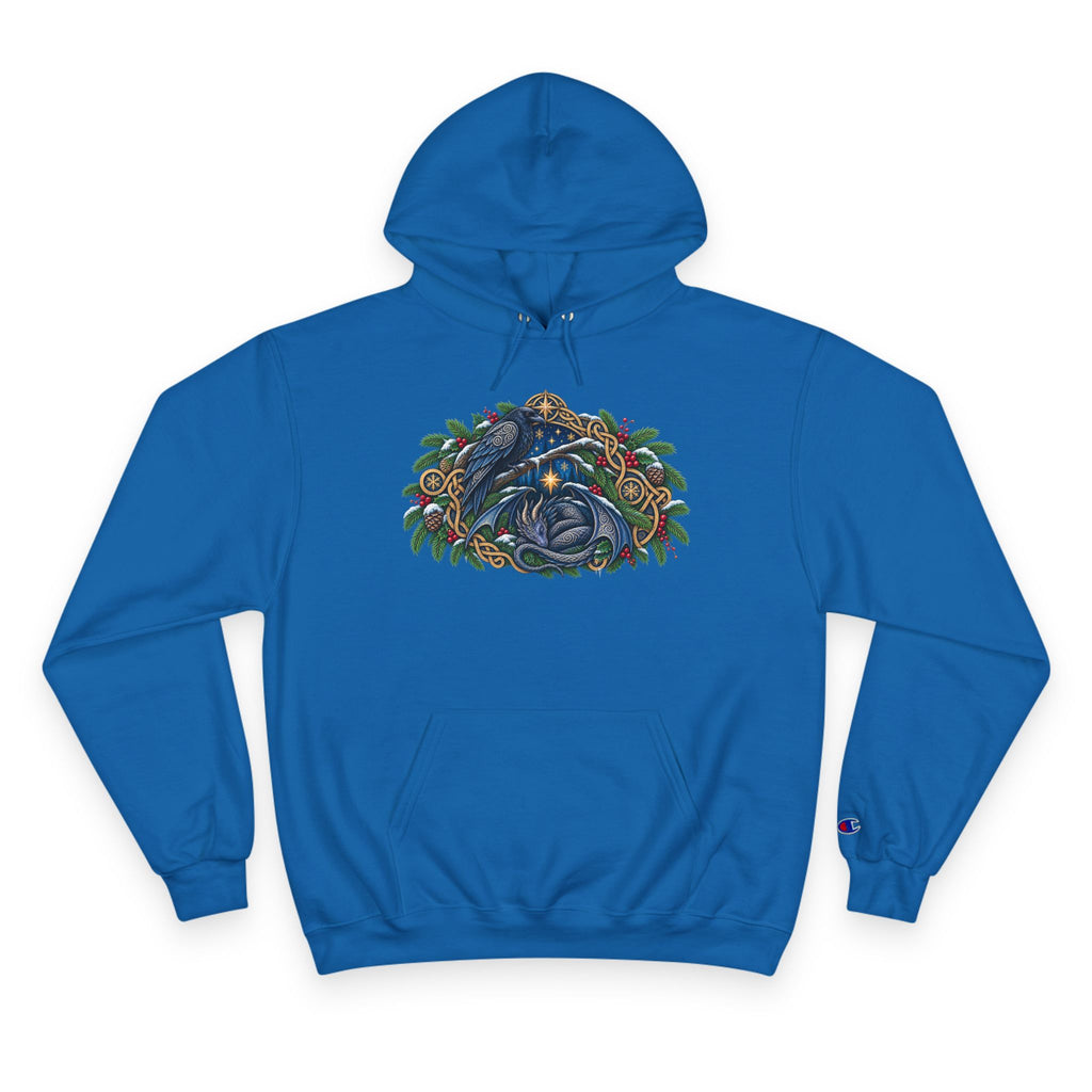 A royal blue  pullover hoodie featuring a detailed graphic of a blue raven and a dragon surrounded by green pine boughs  A small blue Champion 'C' logo is visible on the left sleeve cuff. against a white background