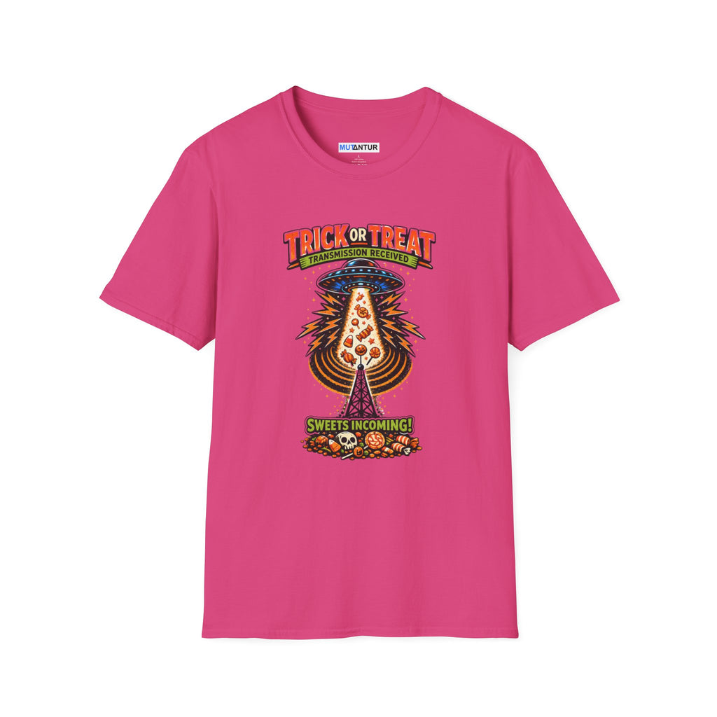 A bright pink short-sleeve crewneck t-shirt featuring a colorful graphic print on the front. The graphic shows a UFO Beaming up candy flying upward from a haunted house under the text 'TRICK OR TREAT' and 'SWEETS COMING !'