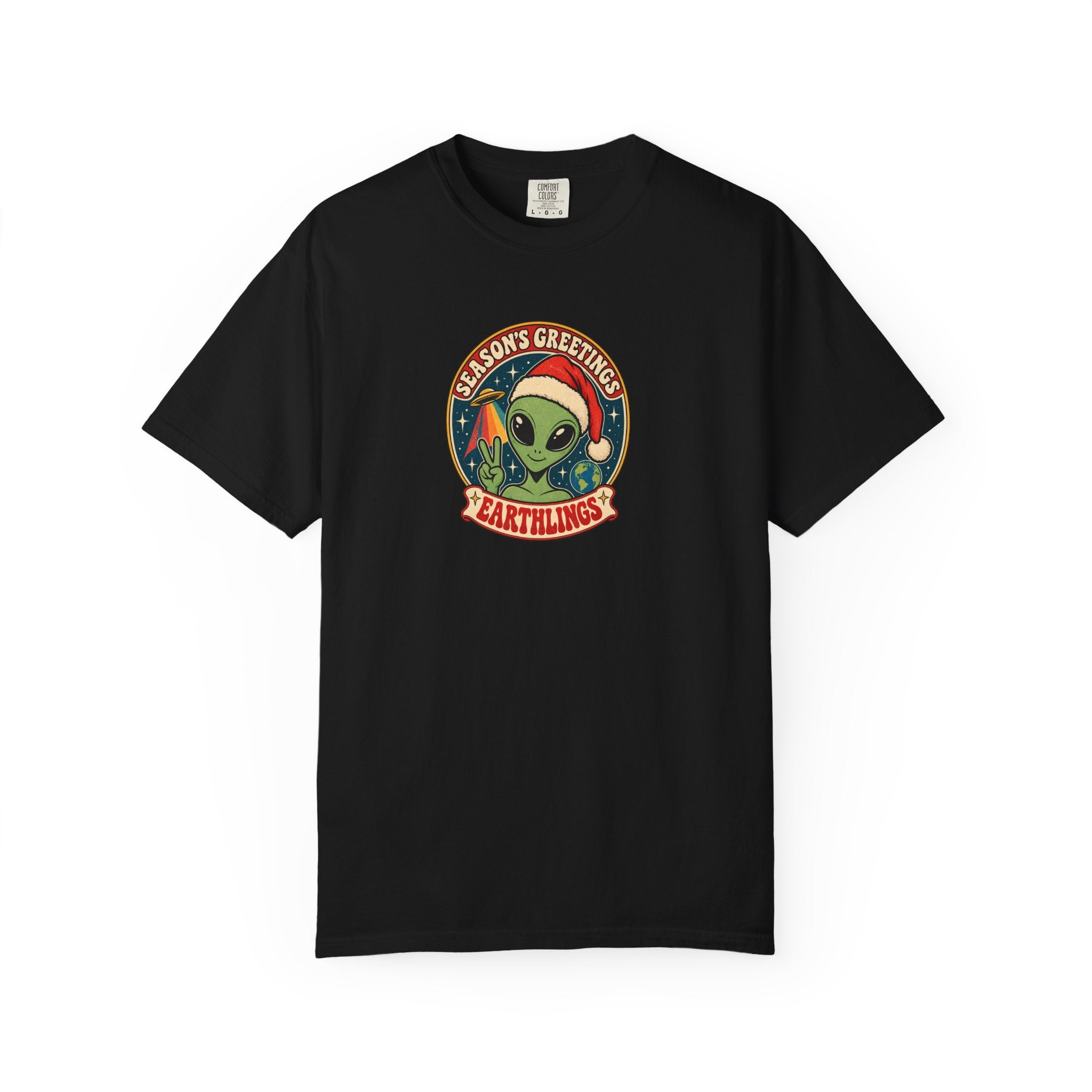 A black short-sleeve crewneck t-shirt featuring a circular graphic on the chest with a green alien wearing a Santa hat and the text 'ALIENS GREETINGS' and 'EARTHLINGS'.