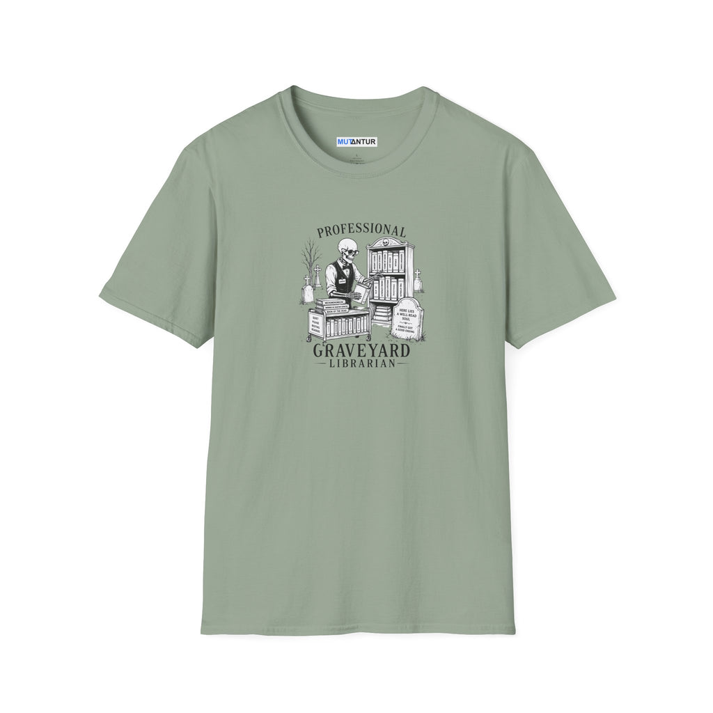 A sage green short-sleeve crewneck t-shirt with a black and white graphic print on the chest depicting a librarian in a graveyard with tombstones and the text 'Professional GRAVEYARD LIBRARIAN'.