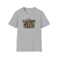 A heather gray short-sleeve t-shirt with a graphic text print on the chest that reads 'MY PERSONALITY IS A CLASS NOT A TRAIT' in gold, black, and white lettering, displayed on a clean white background.
