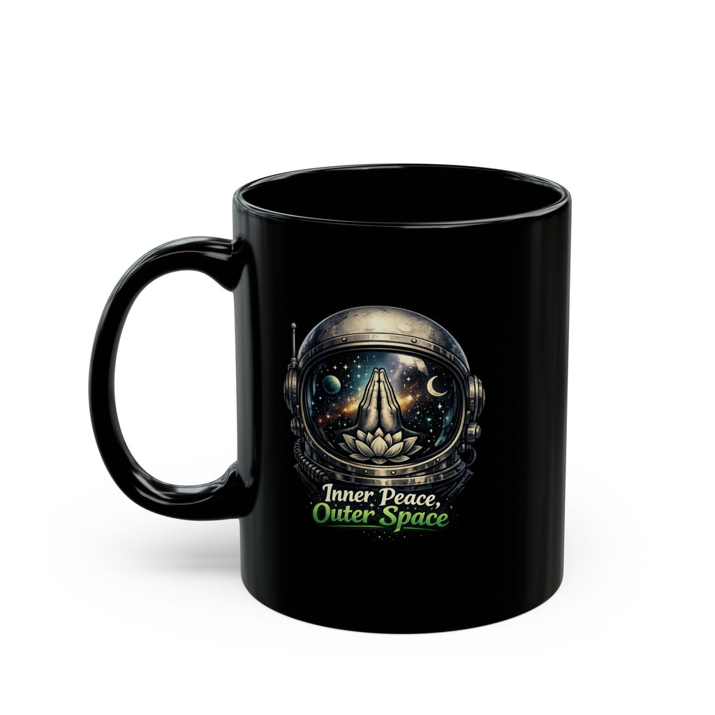 A black ceramic mug with a printed graphic of an astronaut helmet looking inward, with the text 'Inner Peace, Outer Space' written below in white and green, on a white background.