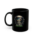 A black ceramic mug with a printed graphic of an astronaut helmet looking inward, with the text 'Inner Peace, Outer Space' written below in white and green, on a white background.