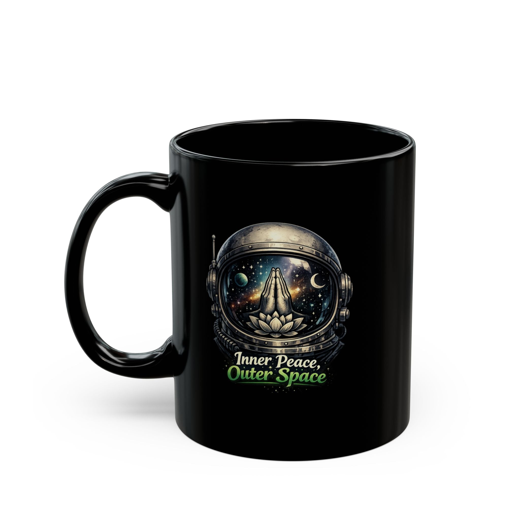 A black ceramic mug with a printed graphic of an astronaut helmet looking inward, with the text 'Inner Peace, Outer Space' written below in white and green, on a white background.