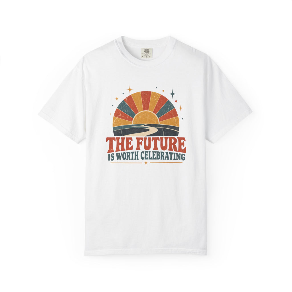 A white short-sleeve crewneck t-shirt featuring a retro sunset graphic on the chest with the text 'THE FUTURE IS WORTH CELEBRATING'.