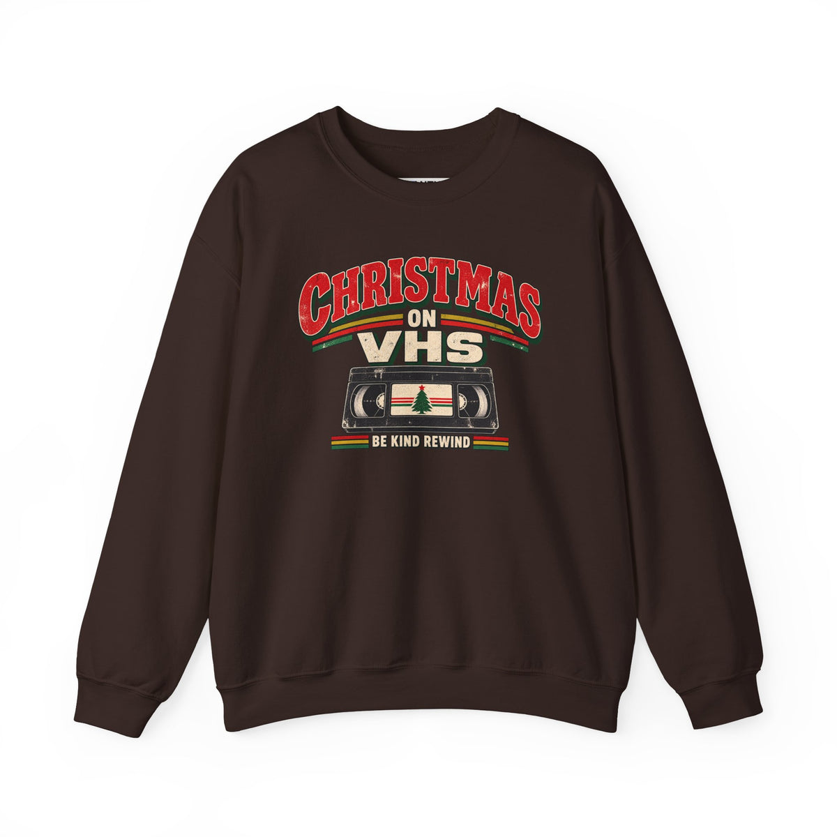 A dark brown crewneck sweatshirt featuring a retro VHS graphic on the chest that reads 'CHRISTMAS ON VHS' with 'BE KIND REWIND' underneath, displayed on a clean white background.