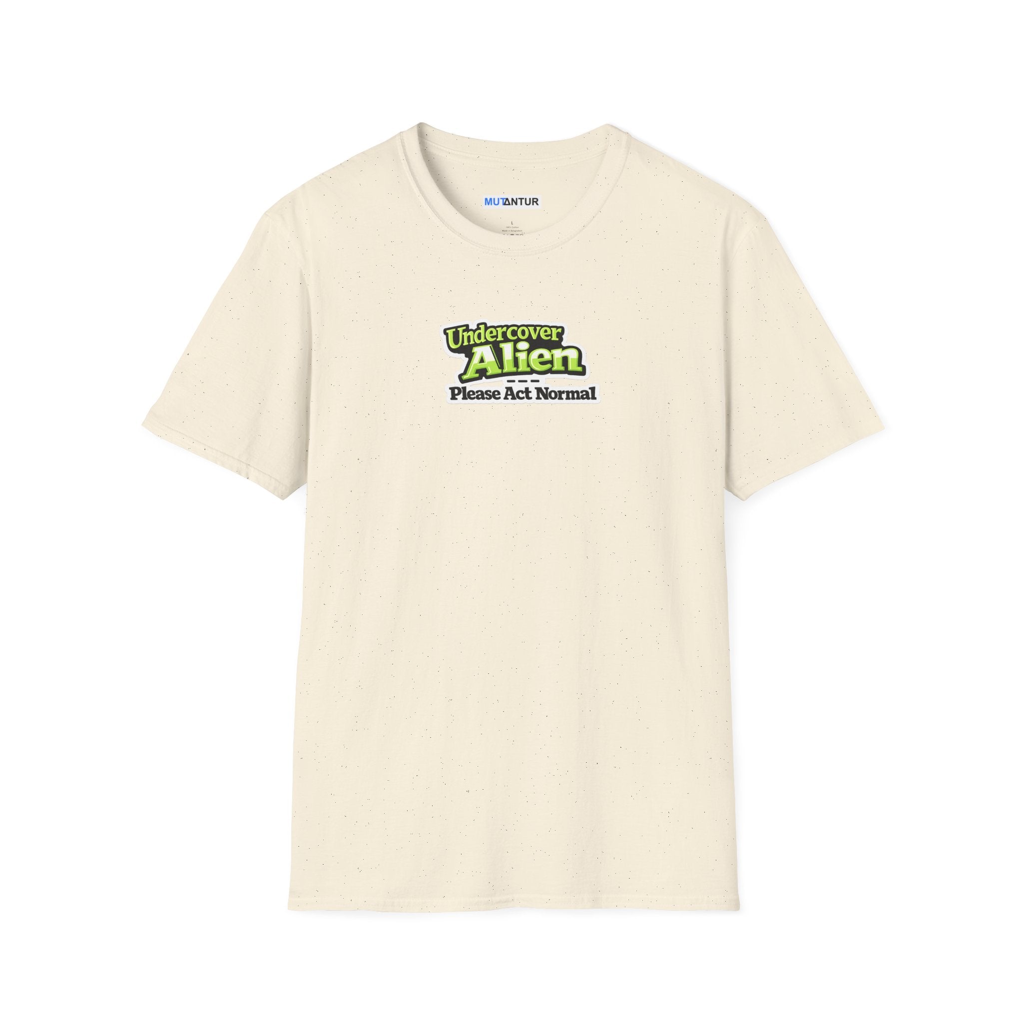 Beige short-sleeve t-shirt with a graphic on the chest that reads 'Undercover Alien Please Act Normal' in green and black