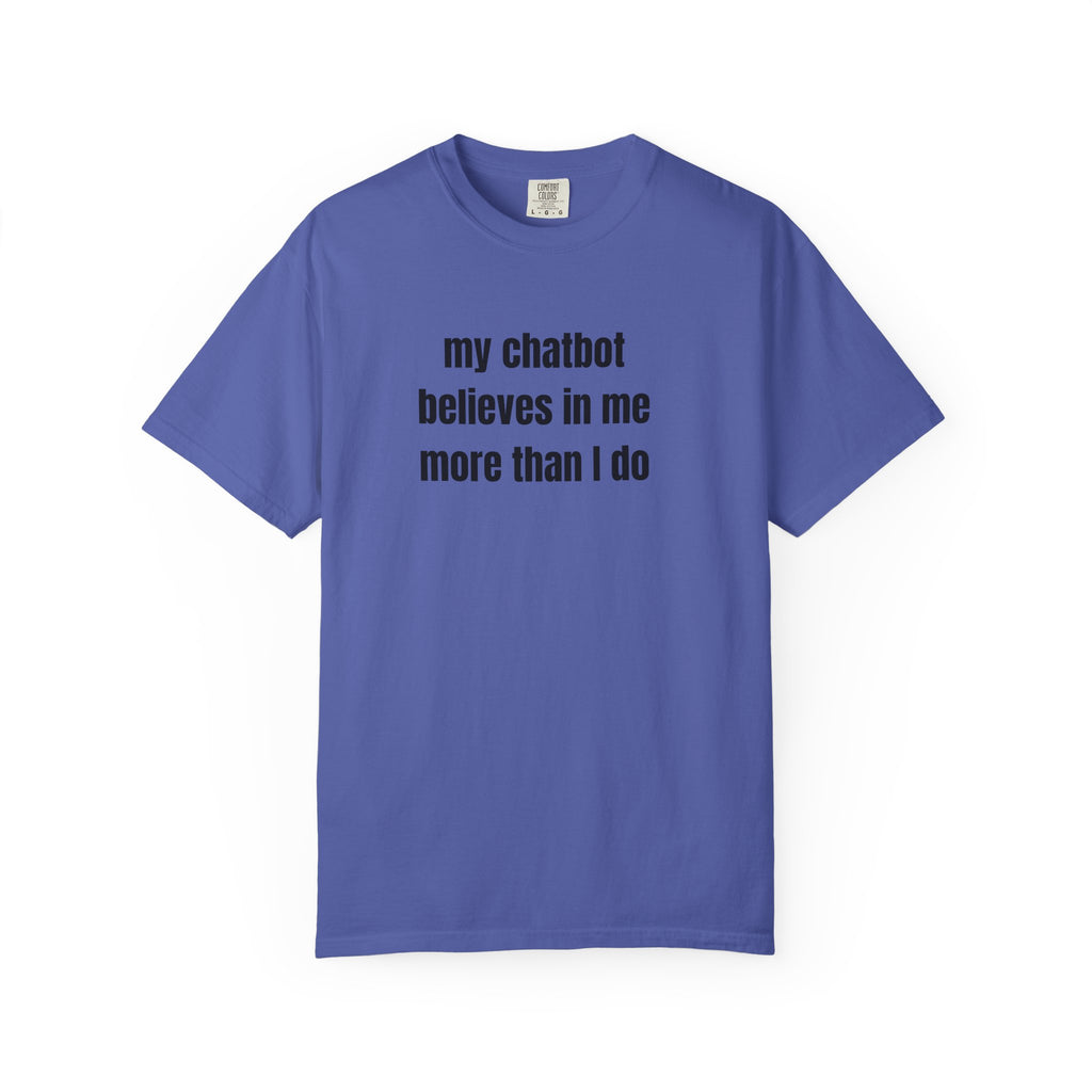 A blue short-sleeve crewneck t-shirt with the text 'my chatbot believes in me more than I do' printed in black sans-serif font across the chest, displayed on a clean white background.