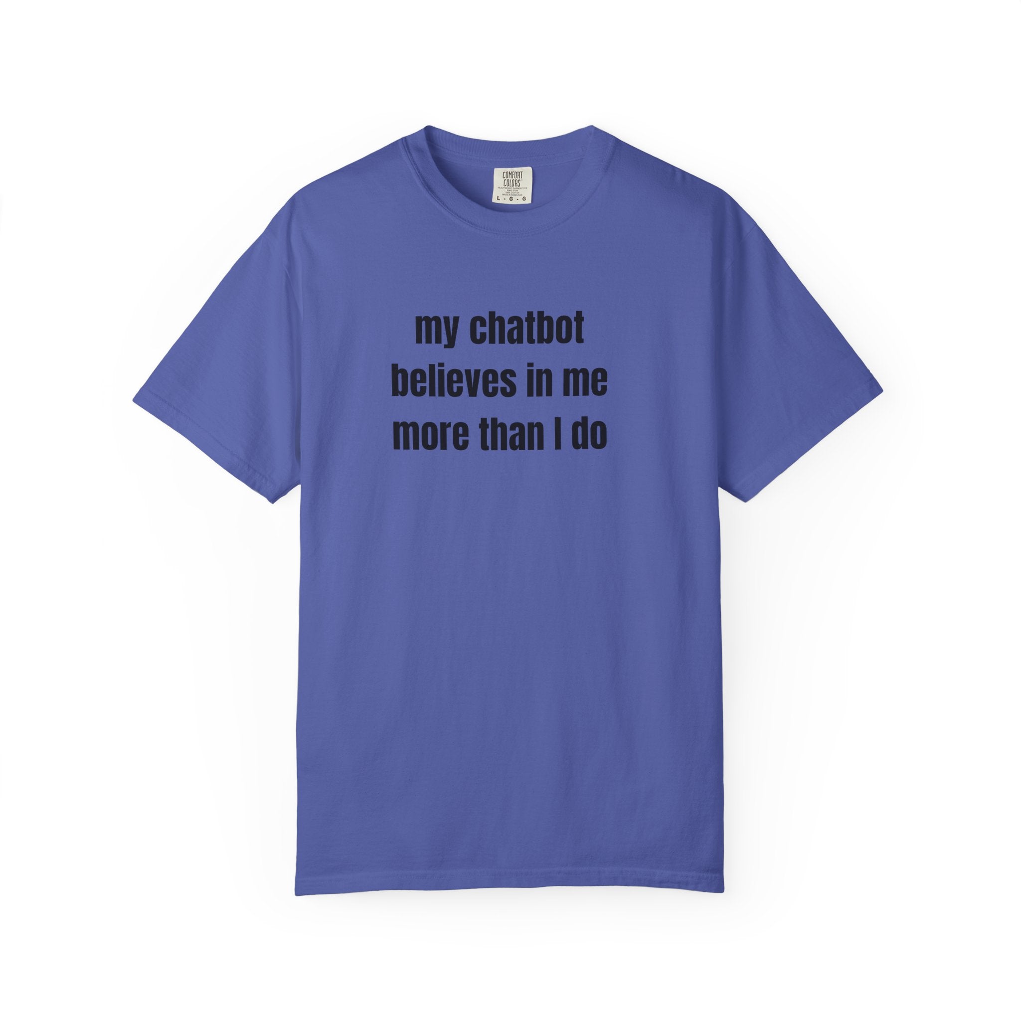A blue short-sleeve crewneck t-shirt with the text 'my chatbot believes in me more than I do' printed in black sans-serif font across the chest, displayed on a clean white background.