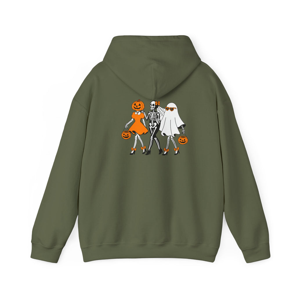 An olive green pullover hoodie shown from the back, featuring a graphic print of three Halloween characters: a pumpkin-headed girl in orange, a skeleton in black and white, and a ghost character in white holding a pumpkin.