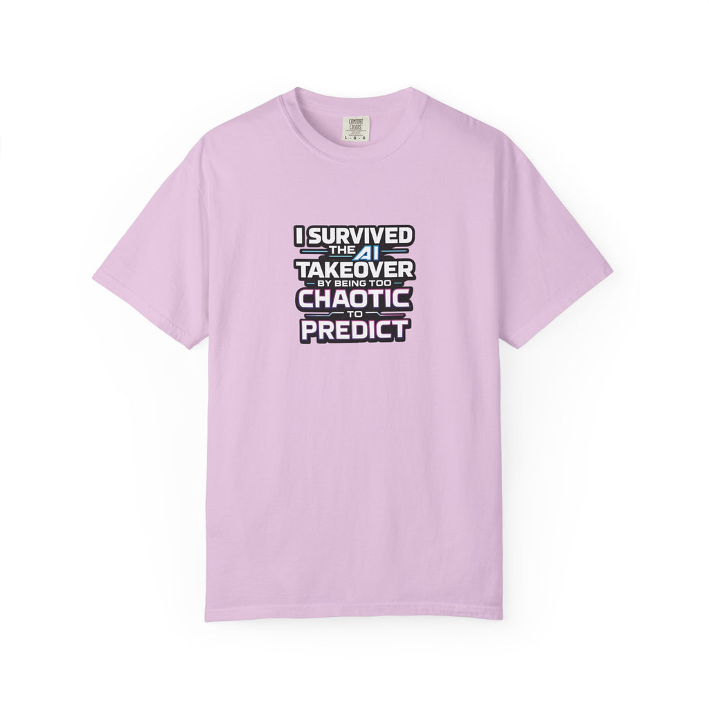 A pink short-sleeve t-shirt with a graphic text print on the chest that reads 'I SURVIVED THE  AI TAKEOVER BY BEING TOO CHAOTIC OR PREDICT'. The shirt is displayed flat against a clean white background.