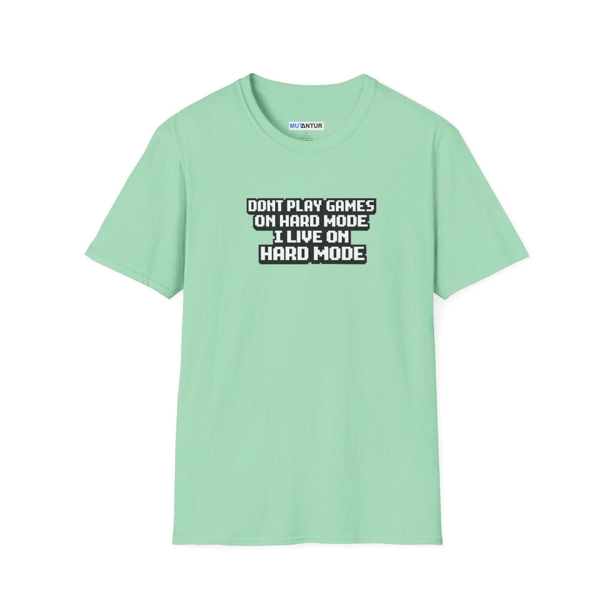 A mint green short-sleeve t-shirt with a black and white graphic text print on the chest that reads 'DONT PLAY GAMES ON HARD MODE I LIVE ON HARD MODE'.