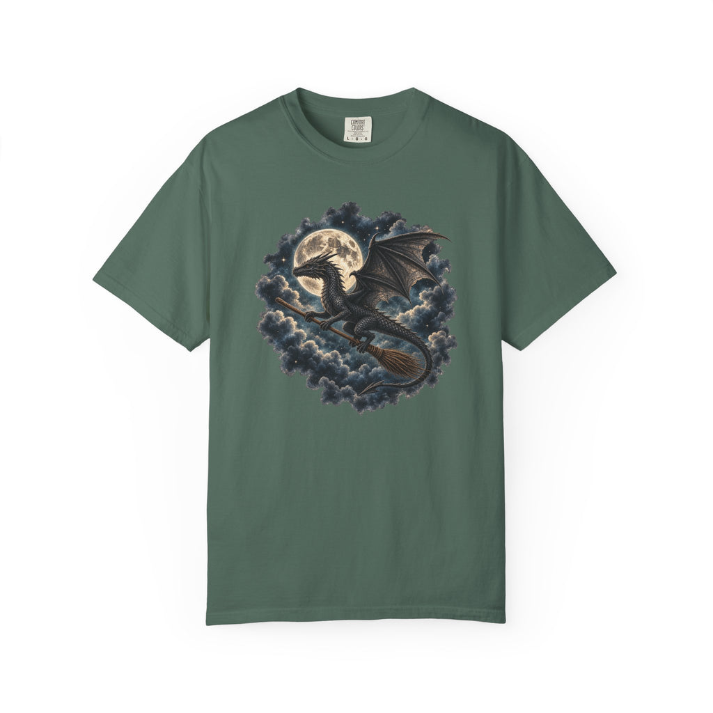 A dark green short-sleeve crewneck t-shirt featuring a detailed graphic of a black dragon flying on a broomstick in front of a full moon and dark clouds.