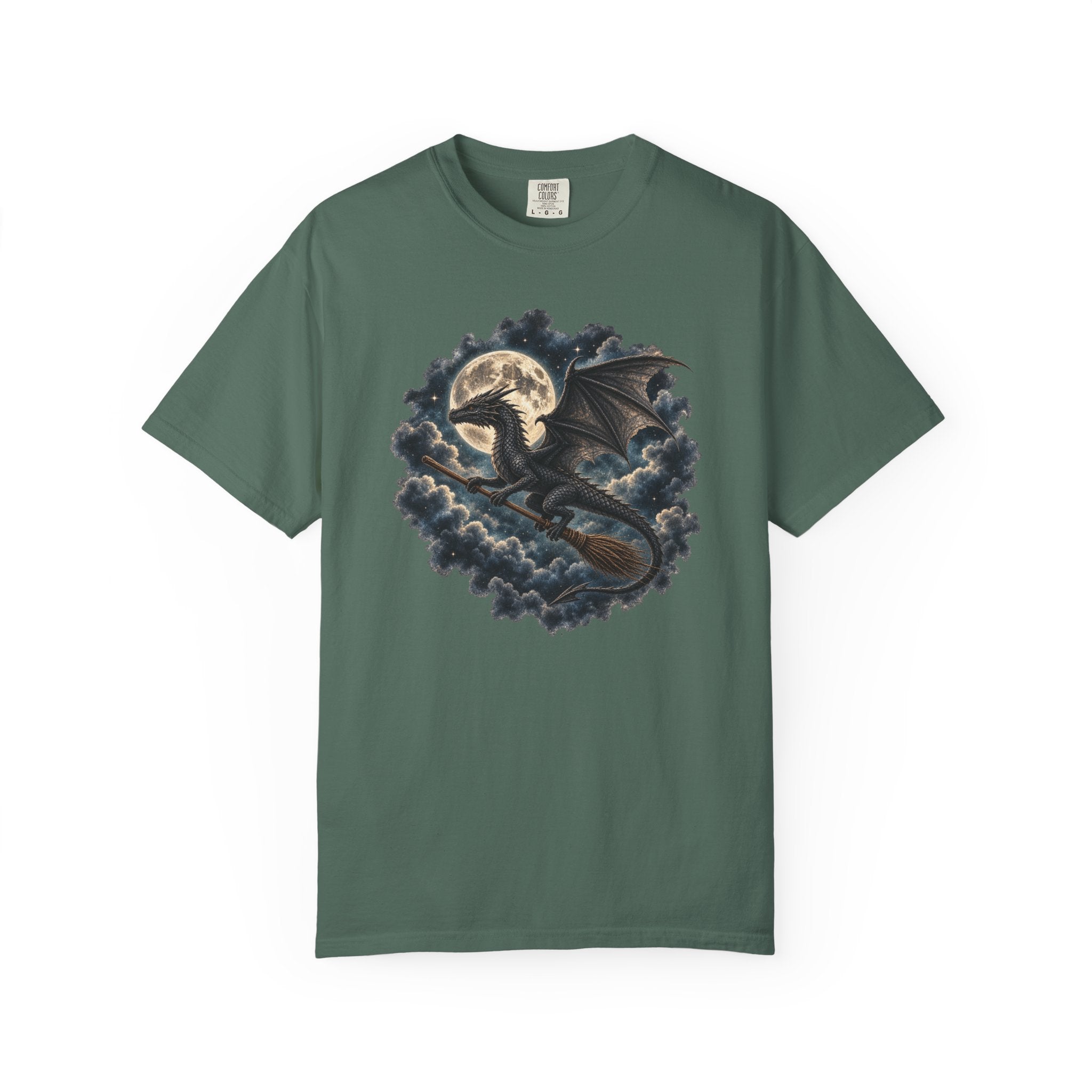 A dark green short-sleeve crewneck t-shirt featuring a detailed graphic of a black dragon flying on a broomstick in front of a full moon and dark clouds.