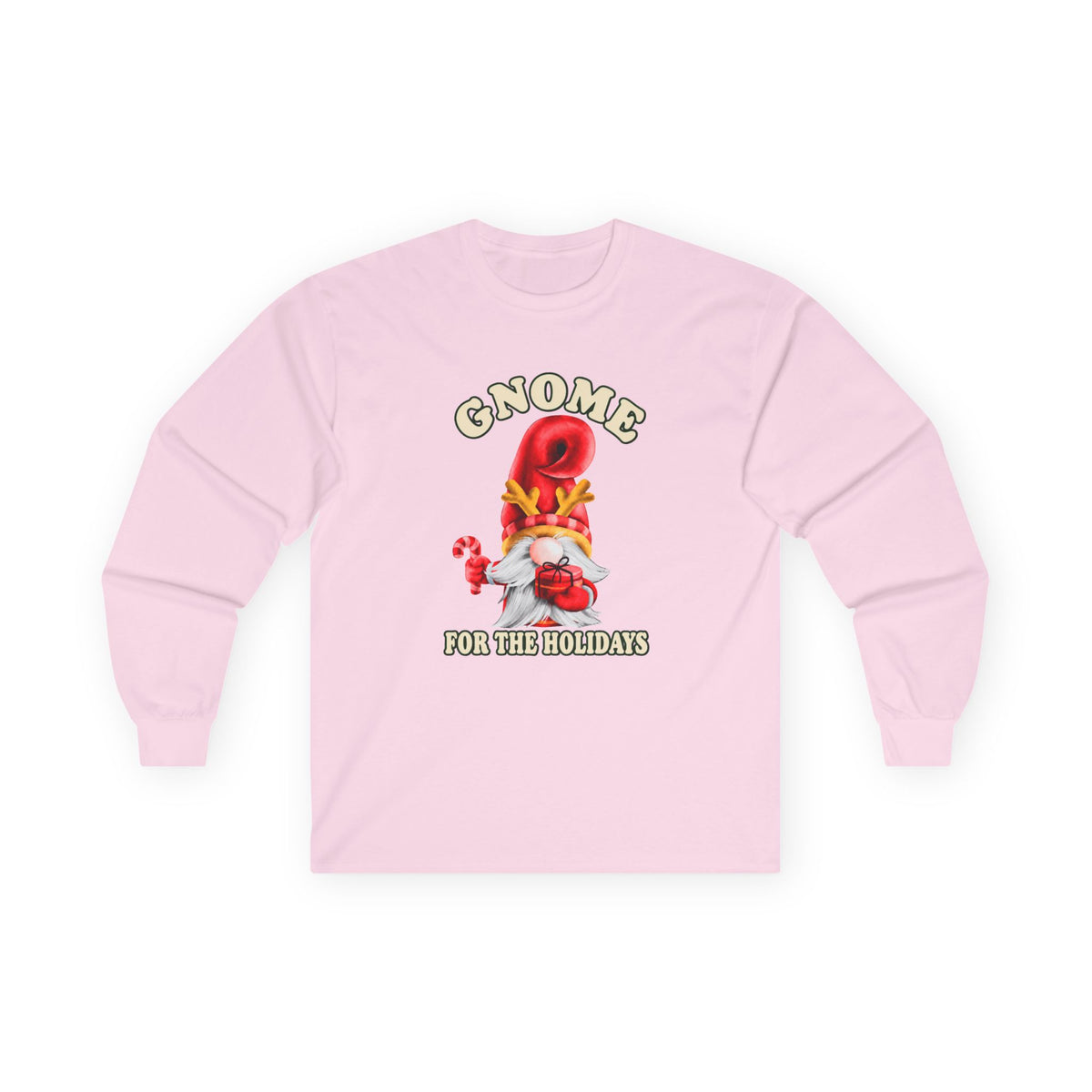 A light pink long-sleeve t-shirt with a festive gnome graphic on the chest. The graphic features a red and gold Christmas tree with a red nose, a white hamster, and the text 'GNOME FOR THE HOLIDAYS' in green and yellow.