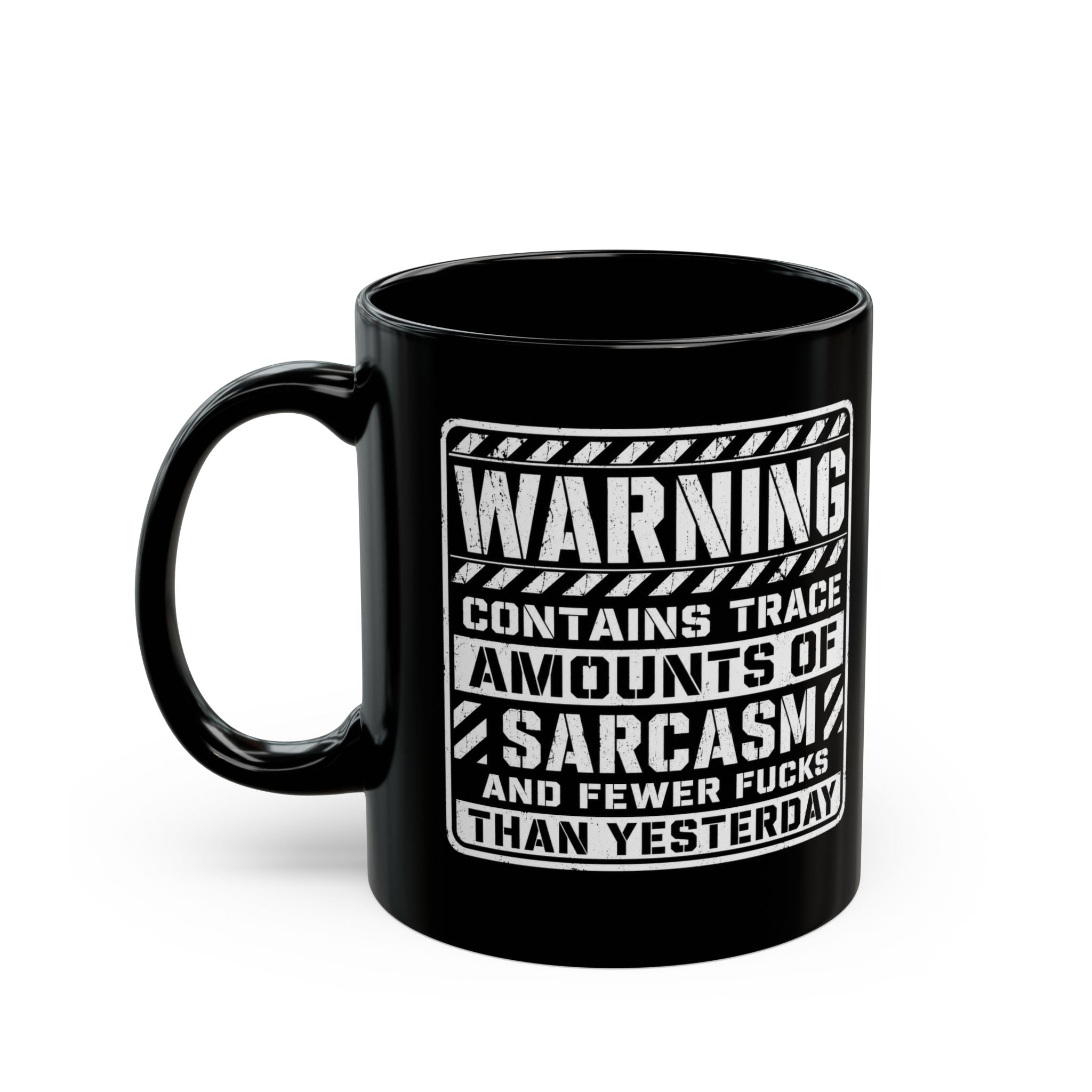 Black ceramic coffee mug printed with the warning label "Contains Trace Amounts of Sarcasm."
