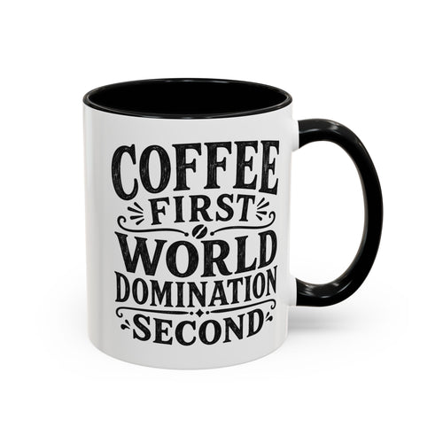 A white ceramic coffee mug with a black handle and black interior, featuring the text 'COFFEE FIRST WORLD DOMINATION SECOND' in black lettering on the front, set against a plain white background.