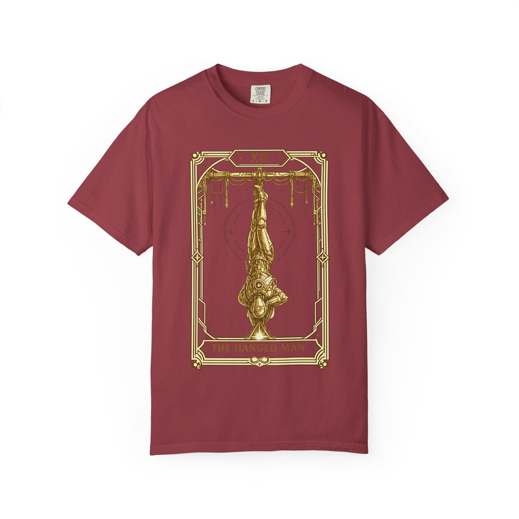 a red Comfort Colors t-shirt featuring The Hanged Man from the Future Arcana collection, inspired by The Hanged Man tarot card. A futuristic explorer hangs suspended upside down within an elegant Art Deco celestial frame, illustrated in vintage gold line art on a transparent background.