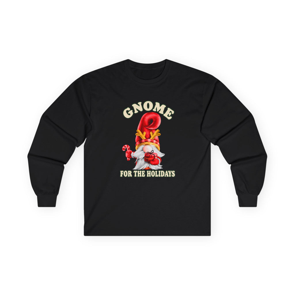 A black long-sleeve t-shirt with a festive gnome graphic on the chest. The graphic features the text 'GNOME FOR THE HOLIDAYS' in a cream-colored font, surrounding an illustration of a gnome wearing a red top hat and a white beard, holding a candy cane.