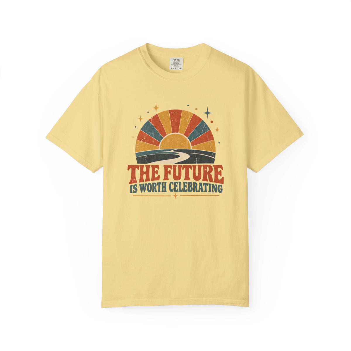 A pale yellow short-sleeve t-shirt with a retro sunset graphic and the text 'THE FUTURE IS WORTH CELEBRATING' printed on the chest, displayed against a plain white background.