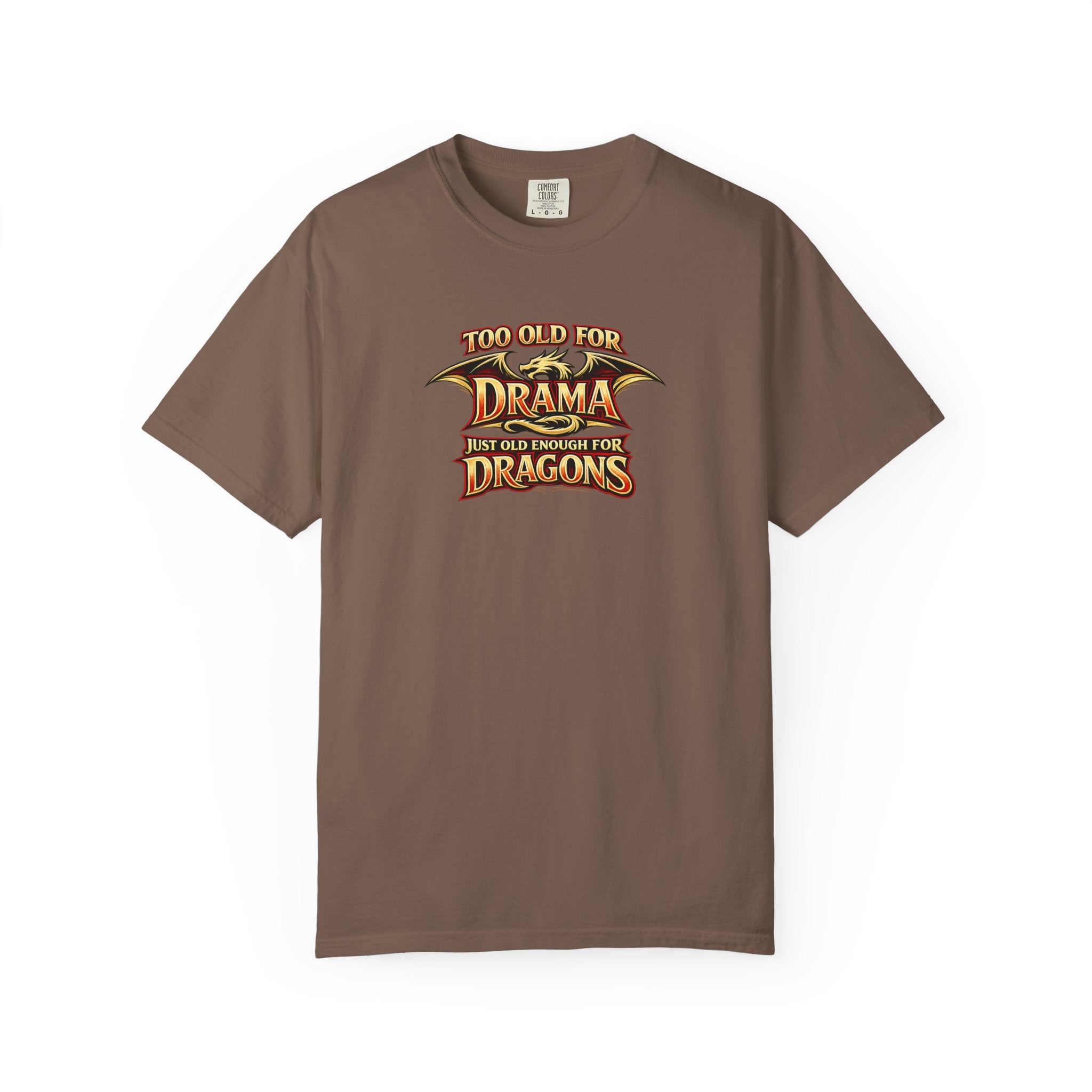 An brown short-sleeve crewneck t-shirt featuring a graphic print on the chest that reads 'TOO OLD FOR DRAMA BUT OLD ENOUGH FOR DRAGONS' in a stylized gold and black dragon-themed font.