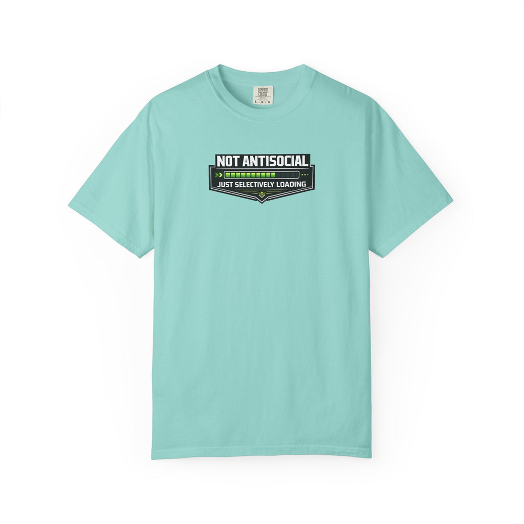 A mint green short-sleeve crewneck t-shirt in khaki beige, featuring a graphic on the chest that reads 'NOT ANTISOCIAL' above a progress bar with green checkmarks and the text 'JUST SELECTIVELY LEARNING' below,