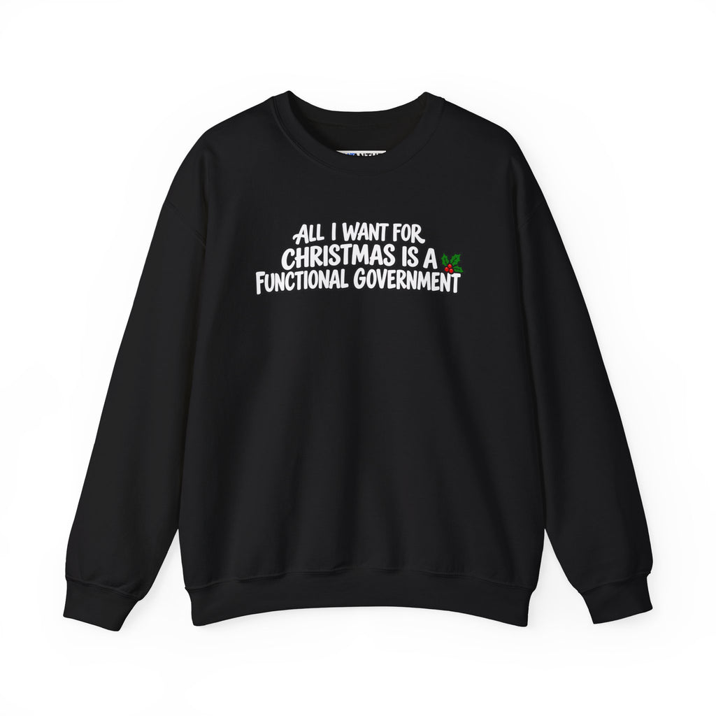 An black crewneck sweatshirt with a graphic text print on the chest reading 'ALL I WANT FOR CHRISTMAS IS A FUNCTIONAL GOVERNMENT' in black and white lettering with a small green and red holiday accent, displayed on a clean white background.