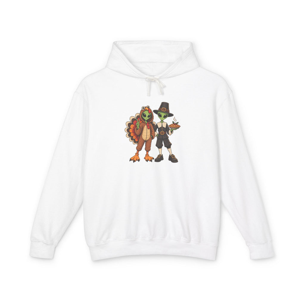 An white hooded sweatshirt with a central graphic of  cartoon aliens dressed as a  turkey and a pilgrim figure, displayed on a clean white background.