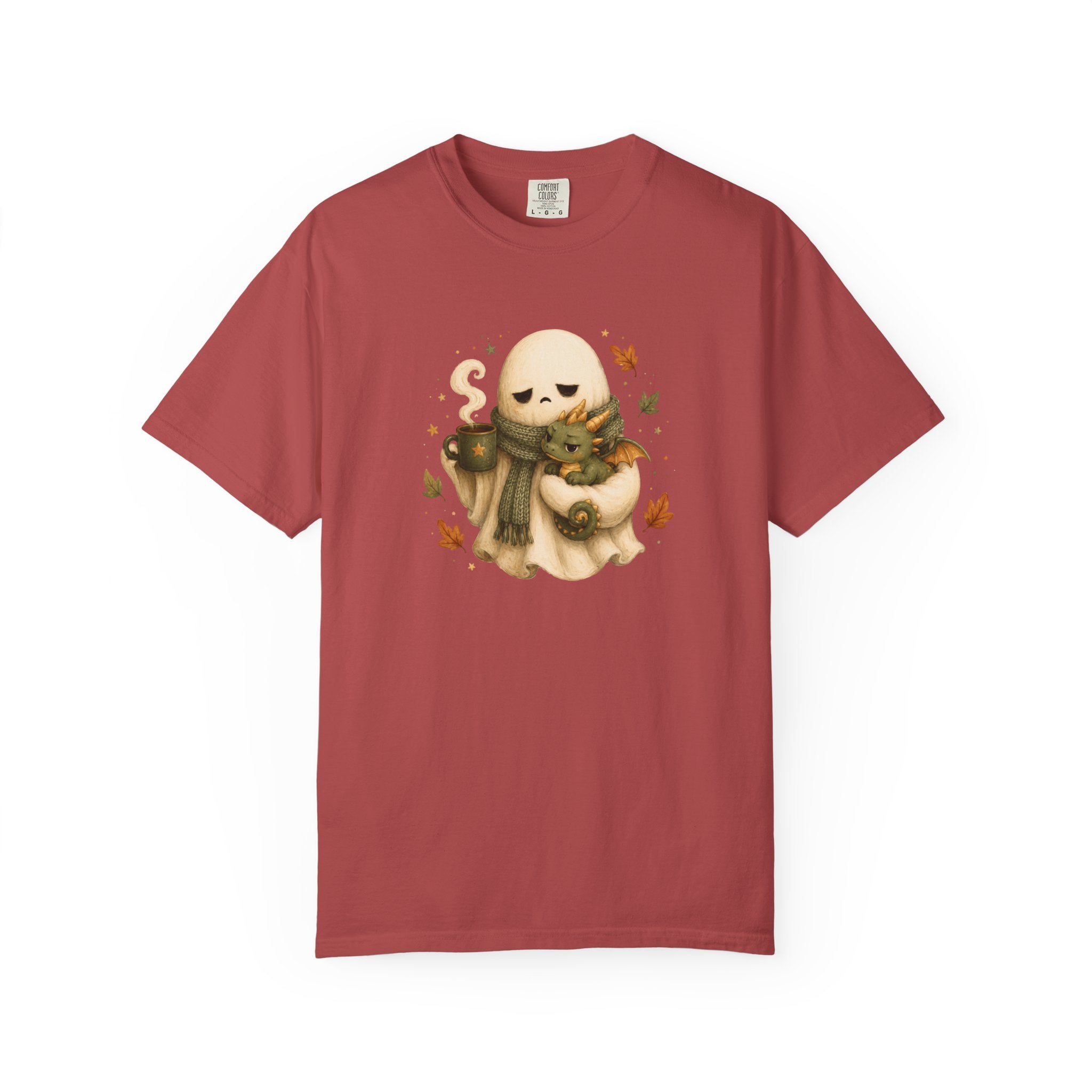 A red short-sleeve crewneck t-shirt featuring a central graphic of a cute cream-colored ghost wearing a green scarf and holding a small dragon, surrounded by orange autumn leaves.