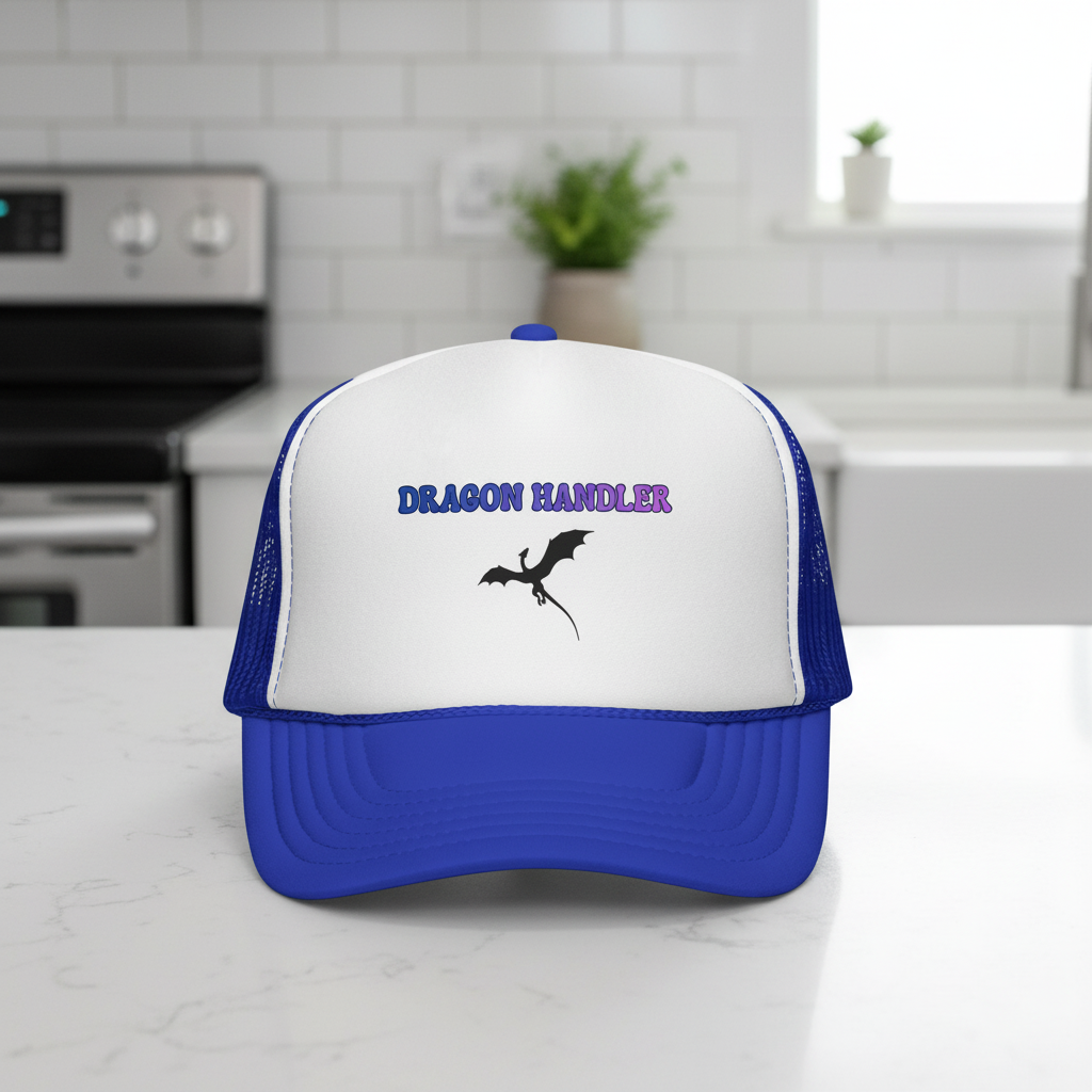 Dragon Handler trucker cap with dragon silhouette in royal blue and white, styled photo on a marble kitchen counter