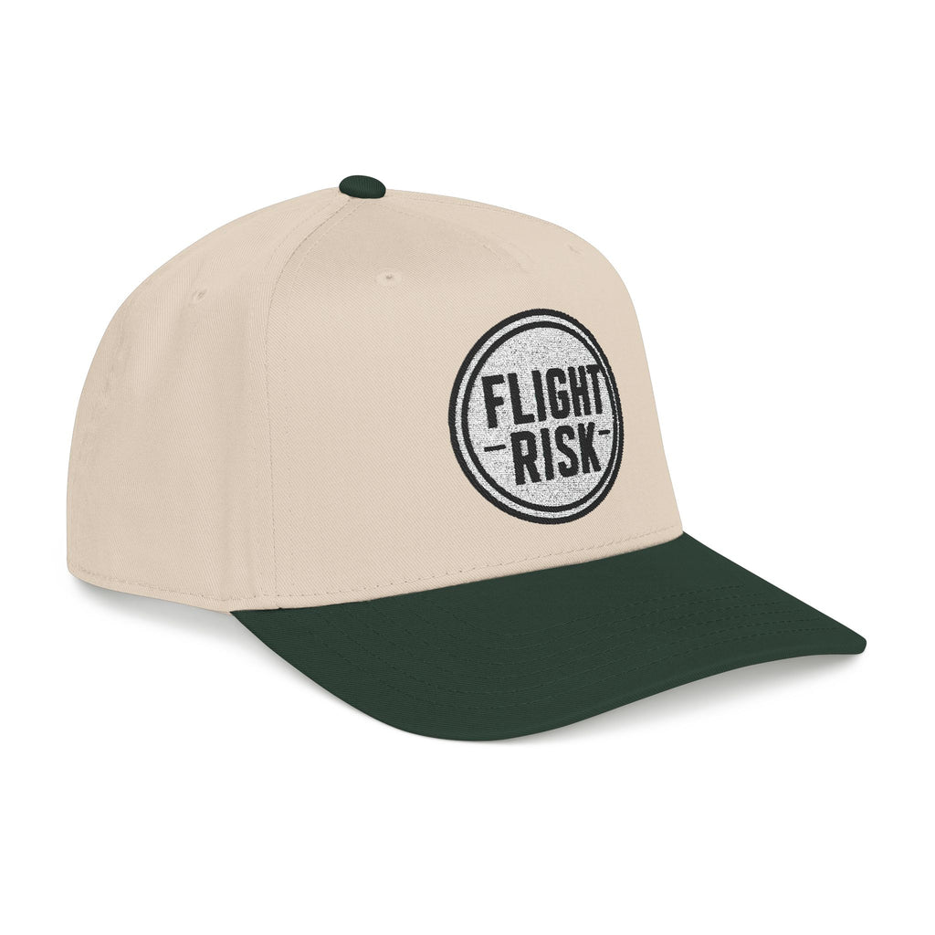 Beige and green baseball cap with a logo  that says FLIGHT RISK on a white background