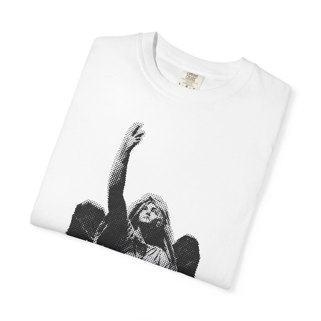 A folded white crewneck t-shirt featuring a black halftone graphic of a bearded man with one arm raised, displayed on a clean white background.