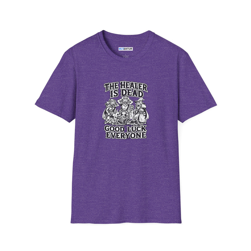 A purple  short-sleeve crewneck t-shirt with a black  and white graphic print on the front. The graphic features the text 'THE HEALER IS DEAD' and 'GOOD LUCK EVERYONE' surrounding an illustration of three figures and a skeleton