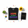 Hope Is Not Passive bold rainbow activist tee, styled shot