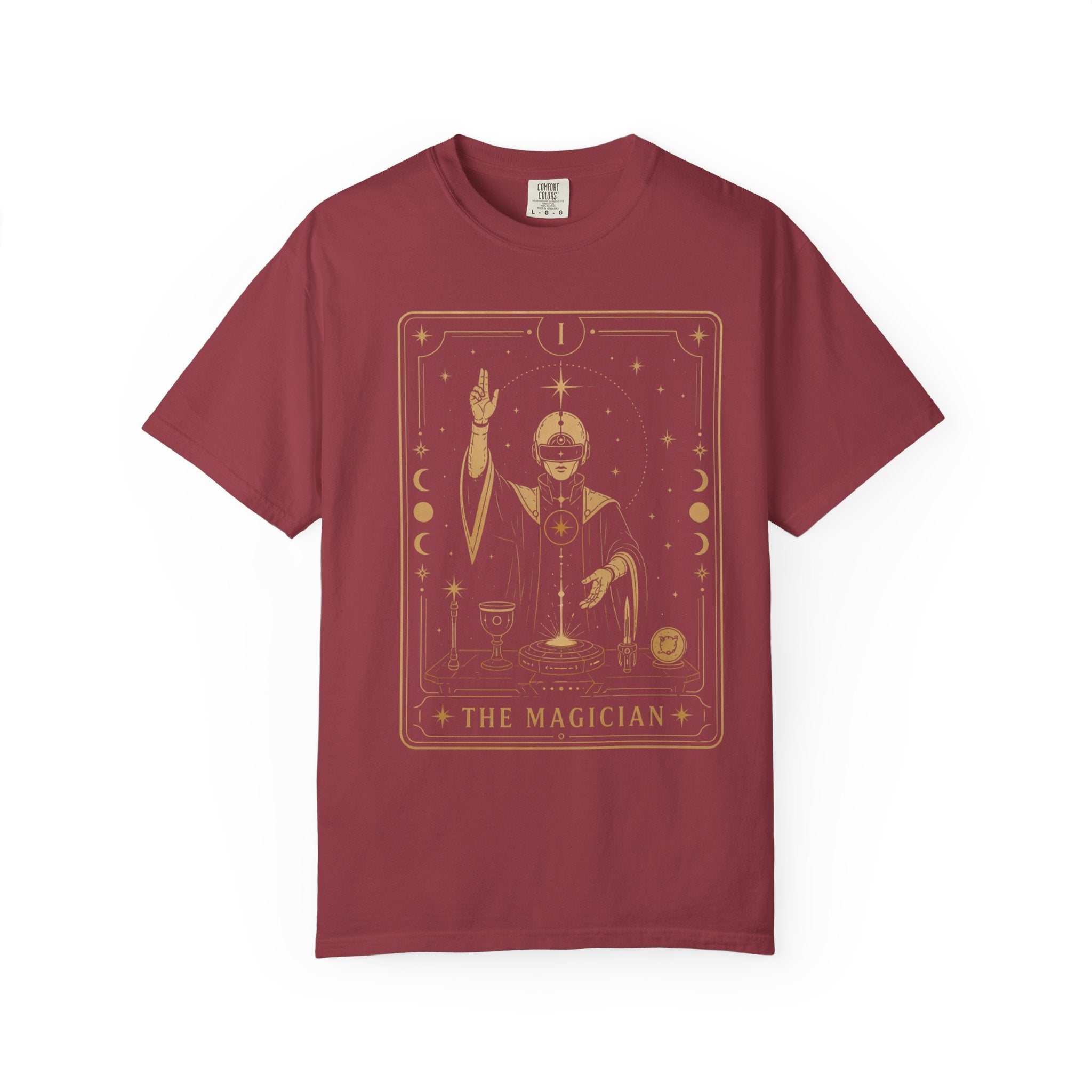 a red A purple short-sleeve crewneck t-shirt featuring a gold-colored graphic of 'The Magician' tarot card on the front, displayed against a solid white background.