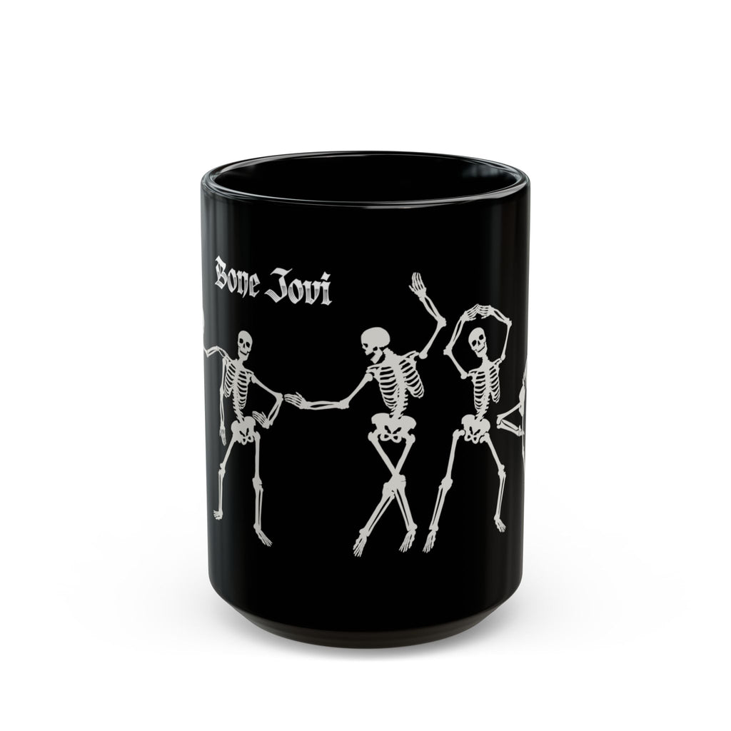 A black ceramic mug featuring white printed graphics of three dancing skeletons and the gothic-style text 'Bone Jovi' on the side, set against a plain white background.