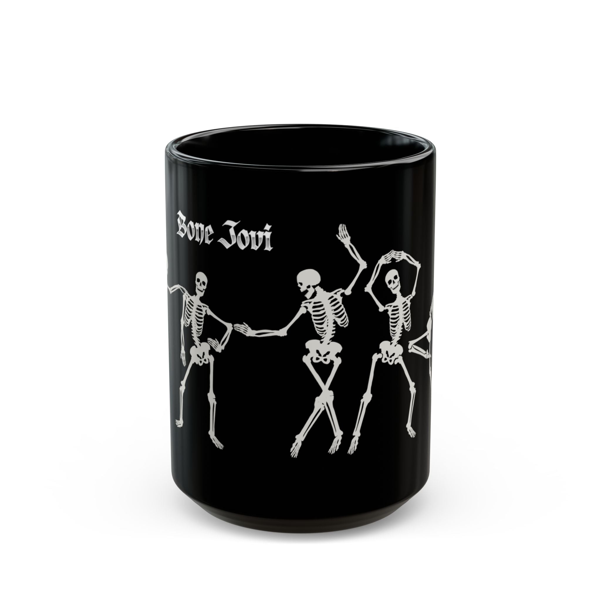A black ceramic mug featuring white printed graphics of three dancing skeletons and the gothic-style text 'Bone Jovi' on the side, set against a plain white background.