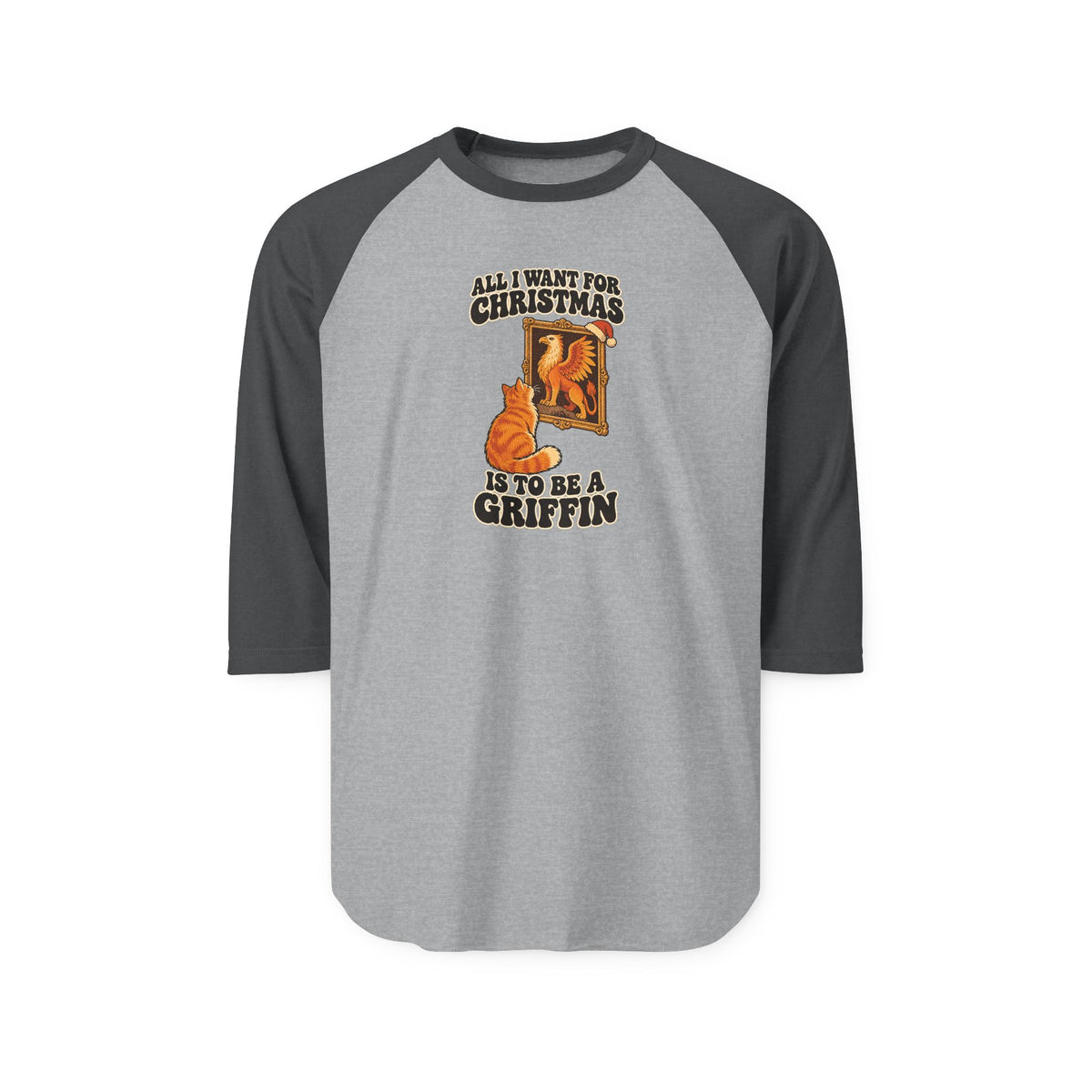 A 3/4 sleeve raglan baseball t-shirt with a heather gray body and dark gray sleeves. The front features a graphic of an orange tabby cat looking at a gold-framed picture, with the text 'ALL I WANT FOR CHRISTMAS IS TO BE A GRIFFIN' in a distressed brown font