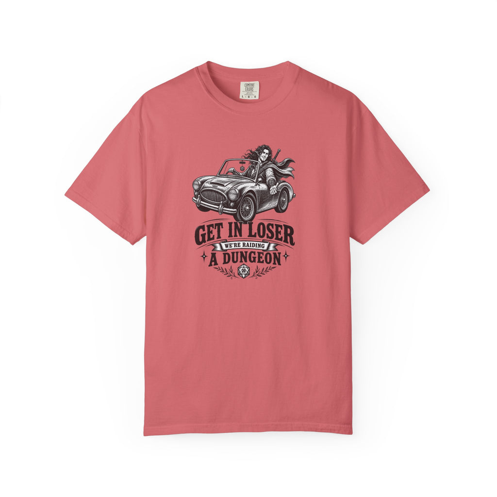 a red t shirt with a black and white design of an elf gamer sitting in a convertible with the word Gei In Loser We're raiding a dungeon  against a white background