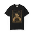 A black Comfort Colors t-shirt featuring The Hierophant from the Future Arcana collection, inspired by The Hierophant tarot card. A futuristic cosmic scholar is framed by celestial Art Deco details in elegant gold line art on a transparent background.