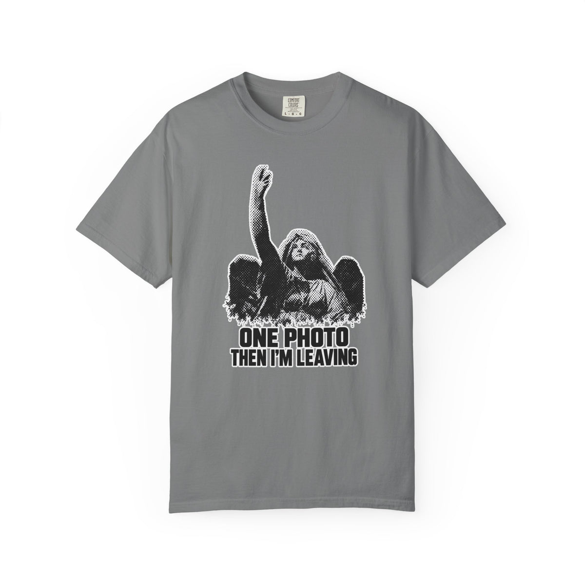 A gray short-sleeve crewneck t-shirt featuring a black and white graphic of a winged angel with raised hand and the text 'ONE PHOTO THEN I'M LEAVING' printed on the front.