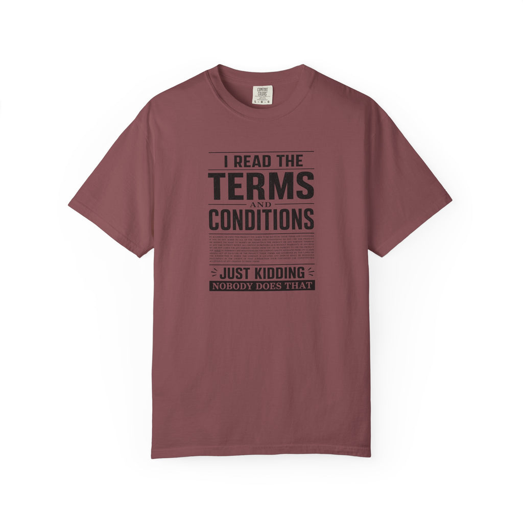 A maroon short-sleeve crewneck t-shirt with a black graphic print on the front that reads 'I READ THE TERMS AND CONDITIONS JUST KIDDING NOBODY DOES THAT' in a newspaper-style layout.