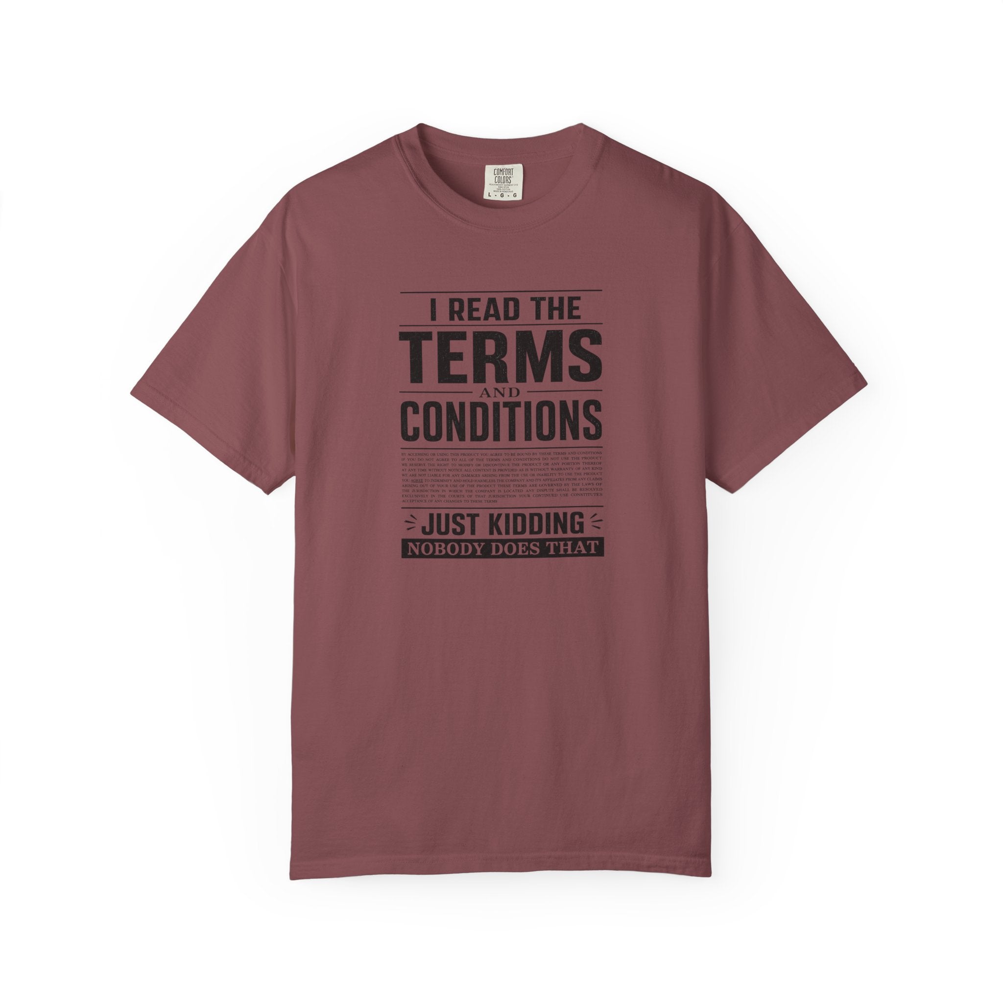 A maroon short-sleeve crewneck t-shirt with a black graphic print on the front that reads 'I READ THE TERMS AND CONDITIONS JUST KIDDING NOBODY DOES THAT' in a newspaper-style layout.
